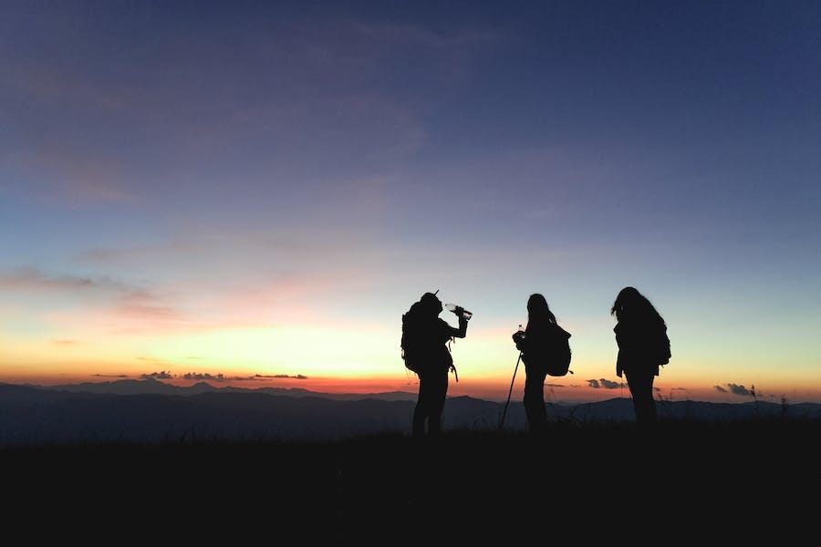 Silhouette of three people